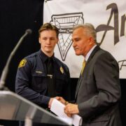 Allegheny County District Attorney Steve Zappala congratulates Pittsburgh Police Officer Evan Honick, ABOVE & BEYOND Awardee, at Amen Corner Law Enforcement Awards Luncheon