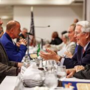 PA State Senator Devlin Robinson (left), talks with KDKA's Jon Delano (center), & District Attorney Steve Zappala (right), at Amen Corner Law Enforcement Awards Luncheon