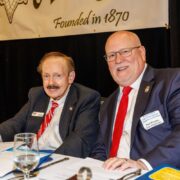 Luncheon Chair Larry Dunn & Vice Chair Paul Krepps confer before Amen Corner Law Enforcement Awards Luncheon