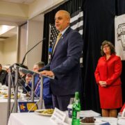 PA Attorney General Dave Sunday speaks as Butler County Commissioner Kim Geyer (standing) and Luncheon Committee Vice Chair Paul Krepps look on